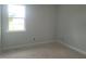 Unfinished bedroom with large window and neutral walls at 72 Cultivator Ct, Angier, NC 27501