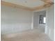Unfinished dining room featuring elegant wainscoting, light gray walls, and a decorative wood beam ceiling at 72 Cultivator Ct, Angier, NC 27501
