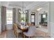 Dining room with a wood table, stylish chairs, and views of the front yard at 72 Cultivator Ct, Angier, NC 27501