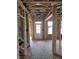 View of an unfinished home entryway showcasing the wood framing and front door at 72 Cultivator Ct, Angier, NC 27501