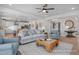 Open-concept living room with hardwood floors, comfortable seating, and stylish decor at 72 Cultivator Ct, Angier, NC 27501
