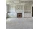 Open living area featuring a fireplace and built-in cabinets perfect for entertaining and cozy nights at 72 Cultivator Ct, Angier, NC 27501