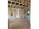 Unfinished living room showcasing wood framing, exposed wiring, and open concept layout at 72 Cultivator Ct, Angier, NC 27501