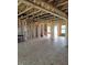 Unfinished living room featuring wood framing, exposed duct work, and open layout at 72 Cultivator Ct, Angier, NC 27501