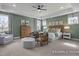 Serene main bedroom with elegant tray ceiling, stylish furnishings, and soft, neutral color palette at 72 Cultivator Ct, Angier, NC 27501