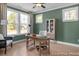 Bright office with three windows, hardwood floors, and a built-in bookcase at 72 Cultivator Ct, Angier, NC 27501