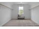 Spacious walk-in closet with ample storage, natural light, and bench seating at 72 Cultivator Ct, Angier, NC 27501
