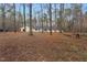 View of the spacious backyard and rear of the home at 7214 Southern Trl, Chapel Hill, NC 27516