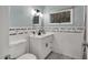 Clean bathroom with white tile, modern fixtures, and a stylish vanity at 7214 Southern Trl, Chapel Hill, NC 27516