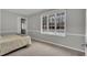 Bright bedroom with plush carpet and a large window offering natural light at 7214 Southern Trl, Chapel Hill, NC 27516