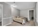 Cozy bedroom with plush carpet, neutral walls, and a comfortable bed at 7214 Southern Trl, Chapel Hill, NC 27516