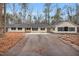 Front elevation with a long driveway at 7214 Southern Trl, Chapel Hill, NC 27516