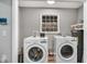 Laundry room features modern washer and dryer at 7214 Southern Trl, Chapel Hill, NC 27516