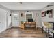 Bright living room with stylish hardwood floors and a functional desk area at 7214 Southern Trl, Chapel Hill, NC 27516