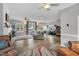 Spacious living room with wood floors, a fireplace, multiple windows and 2 sofas at 7214 Southern Trl, Chapel Hill, NC 27516