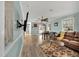 Cozy living room with hardwood floors, comfortable seating, and ample natural light at 7214 Southern Trl, Chapel Hill, NC 27516