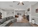 Spacious living room with wood floors, a fireplace, and multiple leather chairs at 7214 Southern Trl, Chapel Hill, NC 27516