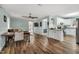 Spacious living room with hardwood floors, dining area, and access to kitchen at 7214 Southern Trl, Chapel Hill, NC 27516