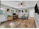 Inviting living room featuring hardwood floors, desk area, and comfortable seating at 7214 Southern Trl, Chapel Hill, NC 27516