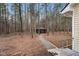 View of the shed in the wooded yard at 7214 Southern Trl, Chapel Hill, NC 27516