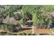 Aerial photograph of the property, taken from a distance, among a forest at 749 Fred Royster Rd, Henderson, NC 27537