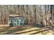 Backyard view of the shed and play equipment at 749 Fred Royster Rd, Henderson, NC 27537