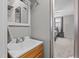 A look from a bathroom through a doorway to a bedroom in a neutral toned home at 749 Fred Royster Rd, Henderson, NC 27537
