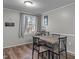 Dining area featuring wood floors, neutral paint, and a view of the outdoors at 749 Fred Royster Rd, Henderson, NC 27537