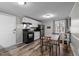 Bright kitchen featuring black appliances and a dining table with four chairs at 749 Fred Royster Rd, Henderson, NC 27537