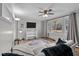 Bright living room with a view of nature, ceiling fan, wood floors, and neutral paint at 749 Fred Royster Rd, Henderson, NC 27537