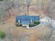 Aerial shot of a beautiful home featuring a well-maintained roof and lush landscaping at 8724 Ten Ten Rd, Raleigh, NC 27603