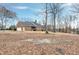 A spacious home with a brick exterior and a large backyard, perfect for outdoor activities at 8724 Ten Ten Rd, Raleigh, NC 27603