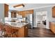 Open kitchen design with stainless steel appliances and a large granite island with seating at 8724 Ten Ten Rd, Raleigh, NC 27603