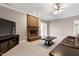 Inviting living room featuring a brick fireplace, plush carpeting, and neutral paint at 8724 Ten Ten Rd, Raleigh, NC 27603