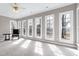 Bright sunroom featuring many windows and natural light at 8724 Ten Ten Rd, Raleigh, NC 27603