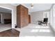 Living room with fireplace, large windows, and comfortable seating at 8724 Ten Ten Rd, Raleigh, NC 27603