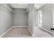 Spacious walk-in closet with ample shelving and carpeted floors for optimal organization and storage at 8724 Ten Ten Rd, Raleigh, NC 27603