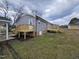 View of new deck and gray siding on the back exterior of the home at 912 Hillsboro St, Oxford, NC 27565