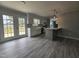 Open concept kitchen featuring gray cabinets, light countertops and wood floors at 912 Hillsboro St, Oxford, NC 27565
