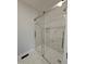 Bathroom shower with a glass enclosure and tiled walls at 912 Hillsboro St, Oxford, NC 27565