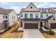 Attractive two-story home boasting brick accents, a two-car garage, and manicured landscaping at 94 Paperwhite Pl, Clayton, NC 27527