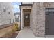 Charming brick home featuring a welcoming front door with a decorative wreath at 94 Paperwhite Pl, Clayton, NC 27527