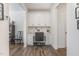 Well-lit home office with built-in cabinets, desk space, and a comfortable chair at 94 Paperwhite Pl, Clayton, NC 27527