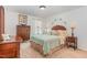 Comfortable bedroom with carpet floors, window, coordinated lamps and decor at 94 Paperwhite Pl, Clayton, NC 27527