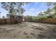 This is a modest backyard with a brick house and a wooden fence. It has lots of potential at 1006 Linwood Ave, Durham, NC 27701