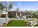 An appealing backyard offers a fire pit, dining area, hot tub, and comfortable seating at 1006 Linwood Ave, Durham, NC 27701