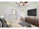 Inviting bedroom with ceiling fan features hardwood floors and ample storage at 1006 Linwood Ave, Durham, NC 27701