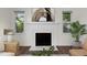 Fireplace featuring a white mantel with decorative painting and tile, offering a cozy focal point to the room at 1006 Linwood Ave, Durham, NC 27701