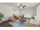 Spacious living room with an open-concept design, neutral tones, wood-look floors, and modern furnishings at 1006 Linwood Ave, Durham, NC 27701