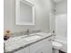 Bright bathroom with a shower-tub combo and a decorative granite counter at 1021 E Edgerton St, Dunn, NC 28334